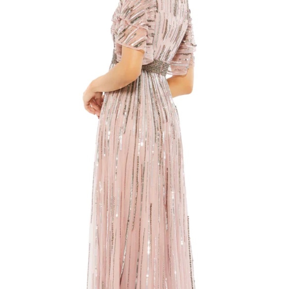 Stunning full- length gown with all over sequin and beaded stripe embellishment.